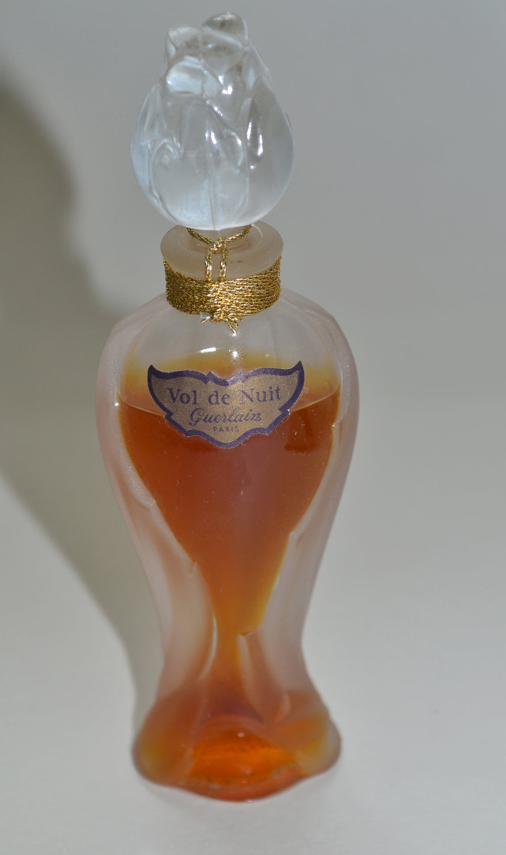Perfume bottle labeled 'Vol de Nuit' by Guerlain on a white background