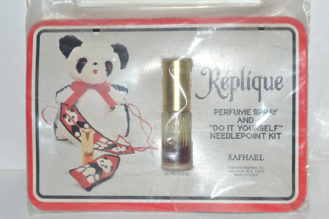 Réplique perfume spray and unused needlepoint kit, front