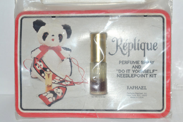 Réplique perfume spray and unused needlepoint kit, front